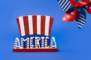 Red, white, and blue America-themed decor featuring stars and stripes on a vibrant blue background. Red, white, and blue America-themed decor featuring stars and stripes on a vibrant blue background.